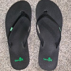 Sanuk black flip flops, size 6